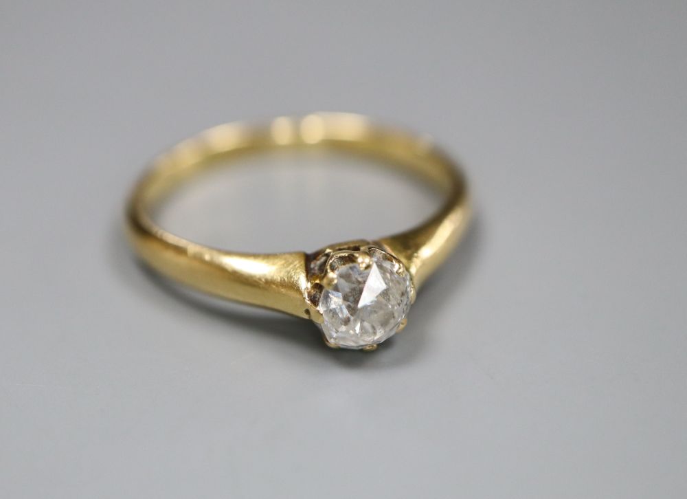 An early 20th century yellow metal and old cut solitaire diamond ring, size M, gross 3 grams.